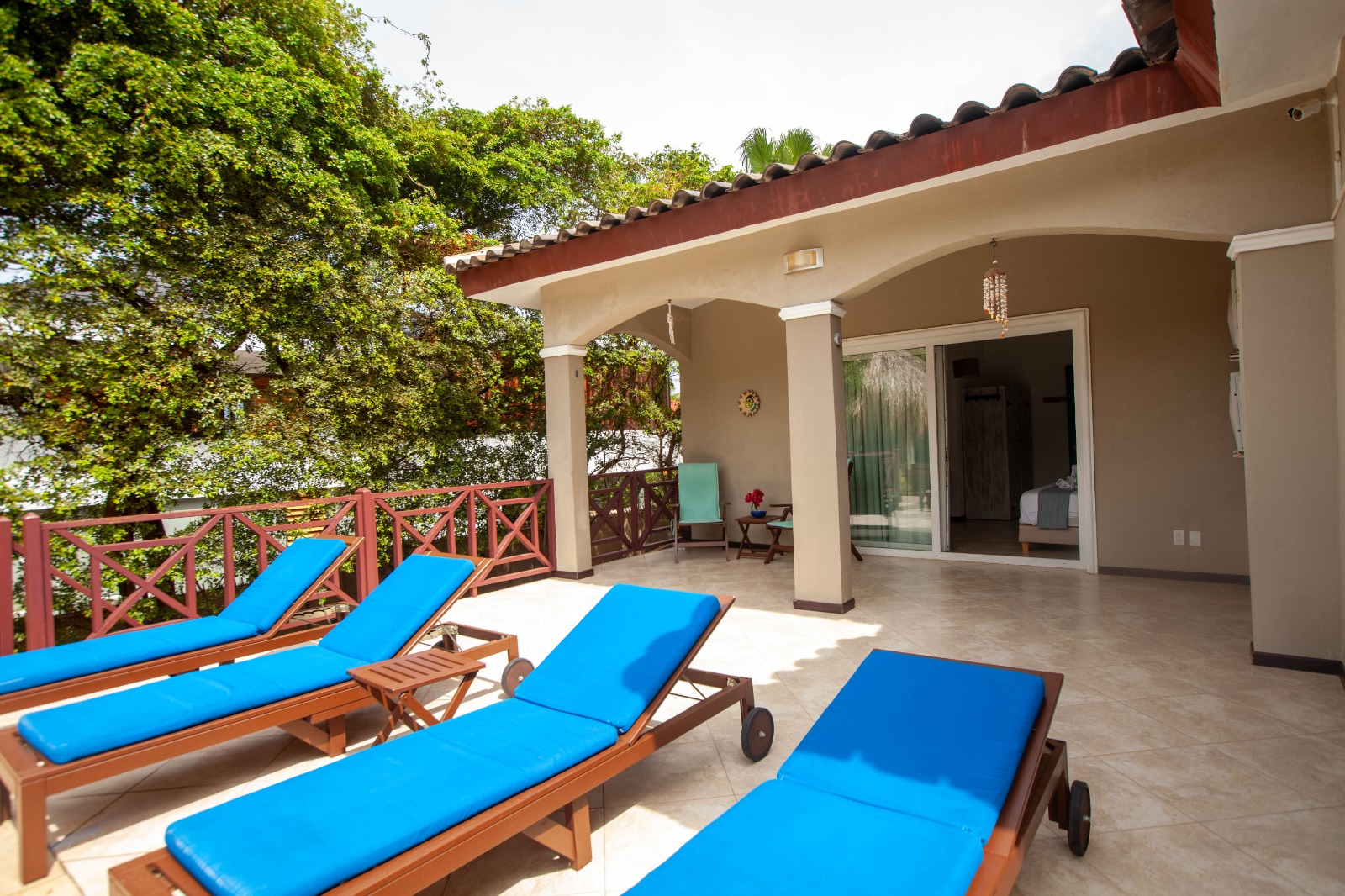 Tropical garden with swimming pool at Hibiscus Beach House